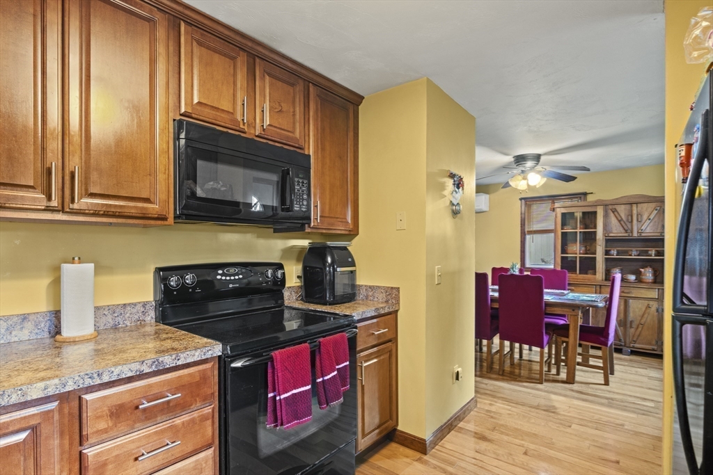 4 Wilson Way Rutland, MA 01543 - Photo 14 of 32 a kitchen with stainless steel appliances granite countertop a stove a microwave and a refrigerator