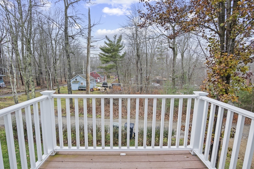 4 Wilson Way Rutland, MA 01543 - Photo 19 of 32 a view of wooden deck and trees in the background
