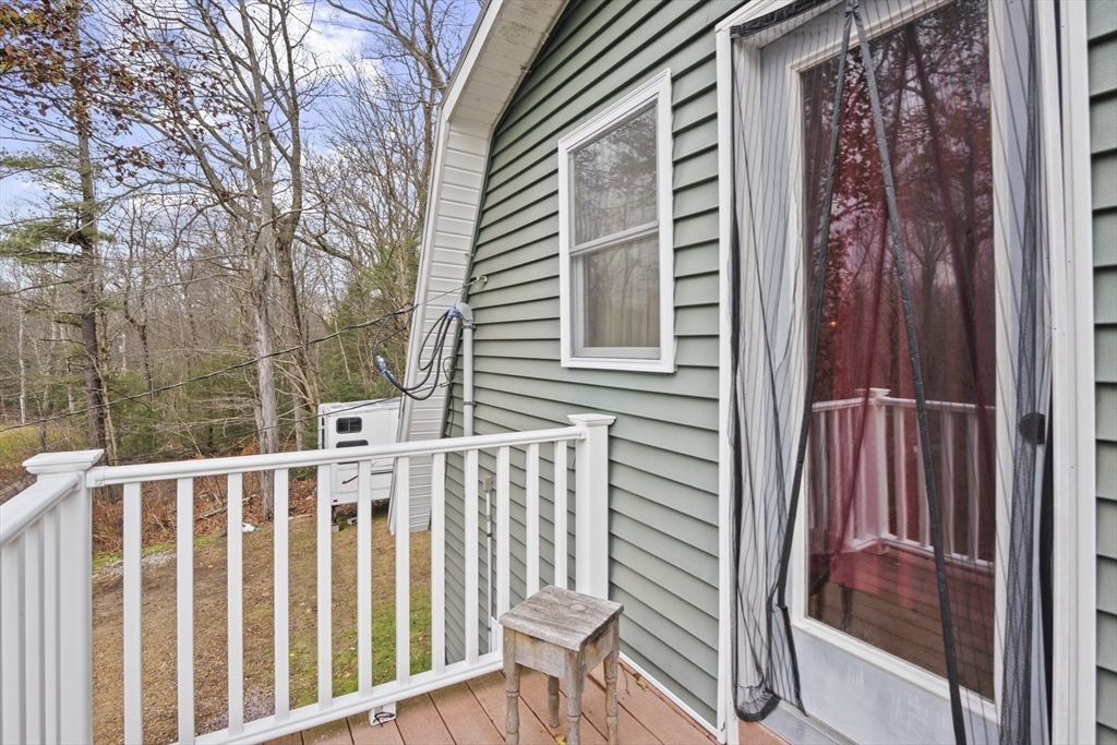 4 Wilson Way Rutland, MA 01543 - Photo 20 of 32 a view of a porch with a bench