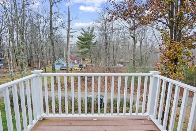 a view of deck and wooden fence