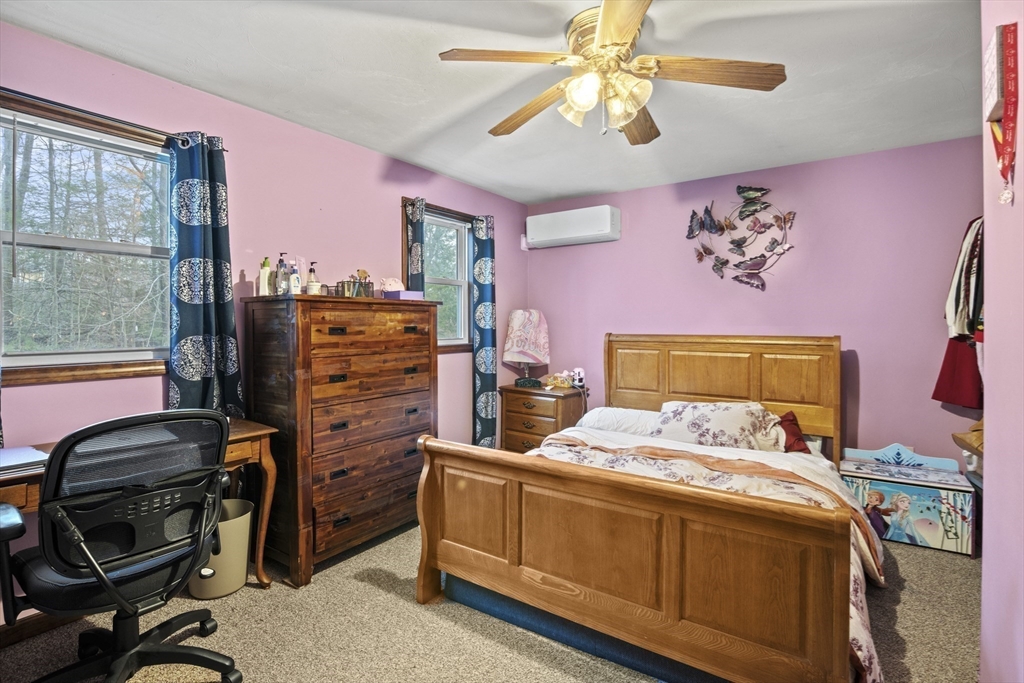 4 Wilson Way Rutland, MA 01543 - Photo 21 of 32 a bedroom with a bed and furniture