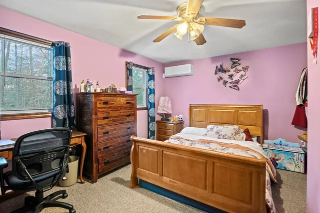 a bedroom with a bed and furniture