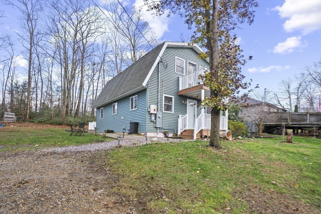 4 Wilson Way Rutland, MA 01543 - Photo 24 of 32 a front view of a house with garden and trees