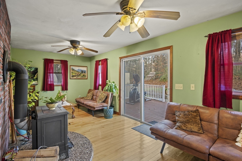 4 Wilson Way Rutland, MA 01543 - Photo 4 of 32 a living room with furniture and a chandelier