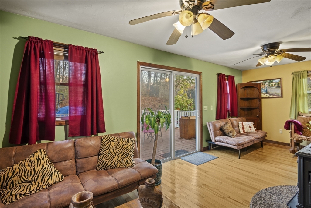 4 Wilson Way Rutland, MA 01543 - Photo 7 of 32 a living room with furniture and a chandelier