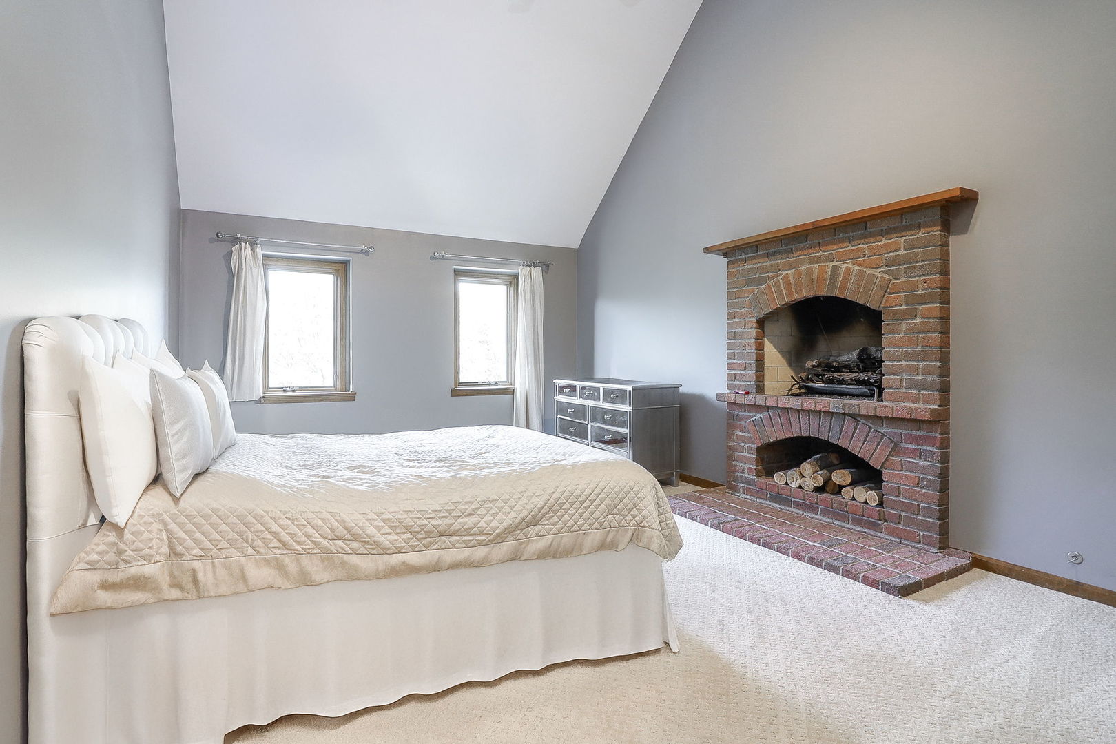 841 Turnbridge Circle Naperville, IL 60540 - Photo 18 of 39 a bedroom with a bed and a fireplace