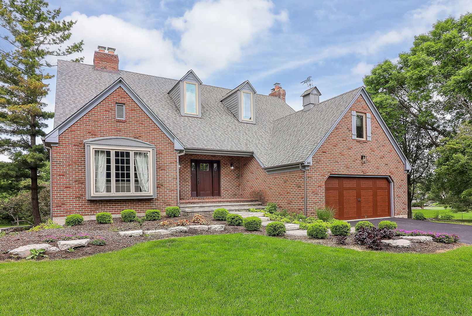 841 Turnbridge Circle Naperville, IL 60540 - Photo 2 of 39 a front view of a house with a yard and garage