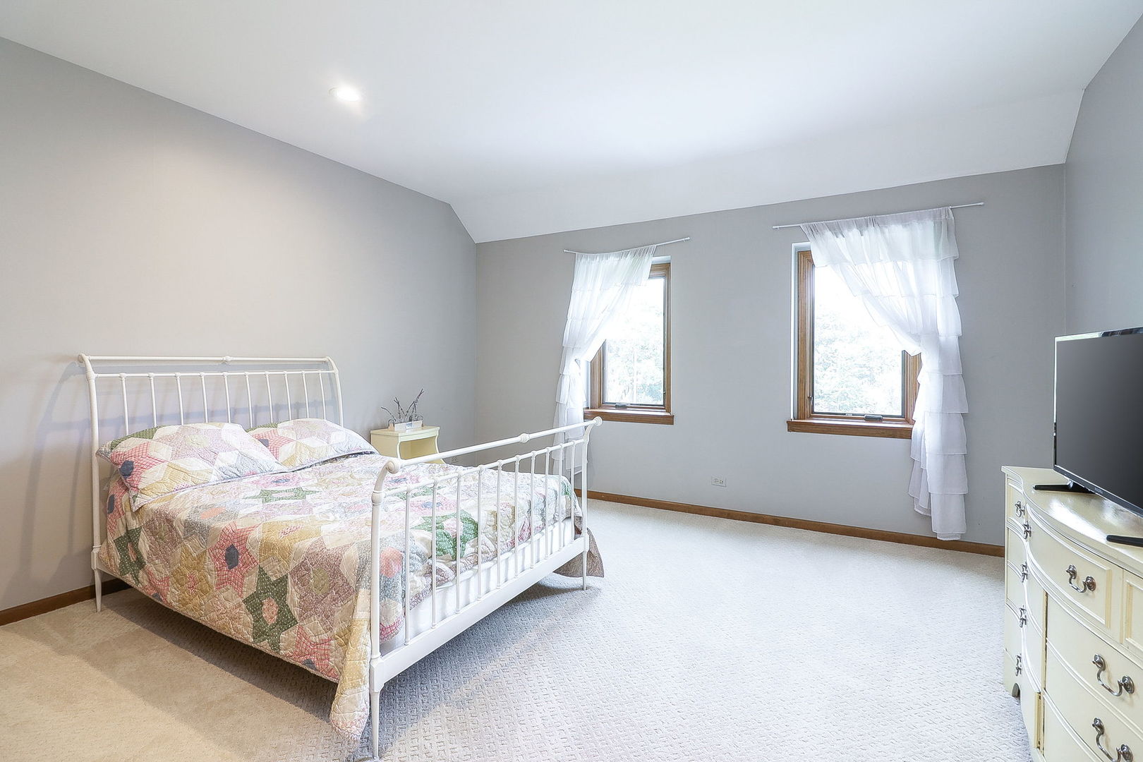 841 Turnbridge Circle Naperville, IL 60540 - Photo 27 of 39 a bed sitting in a bedroom next to a window