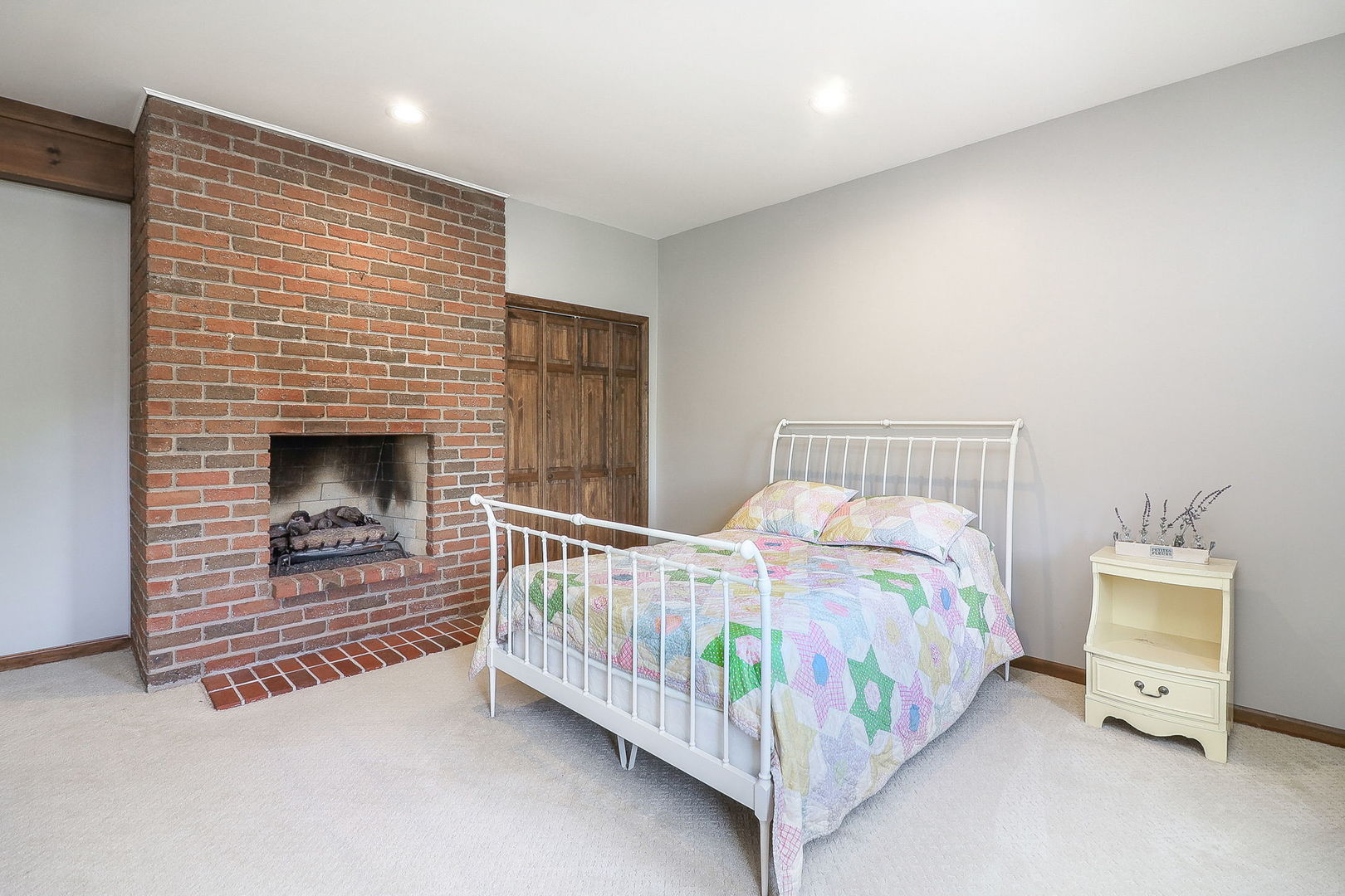 841 Turnbridge Circle Naperville, IL 60540 - Photo 28 of 39 a bedroom with a bed and a fireplace