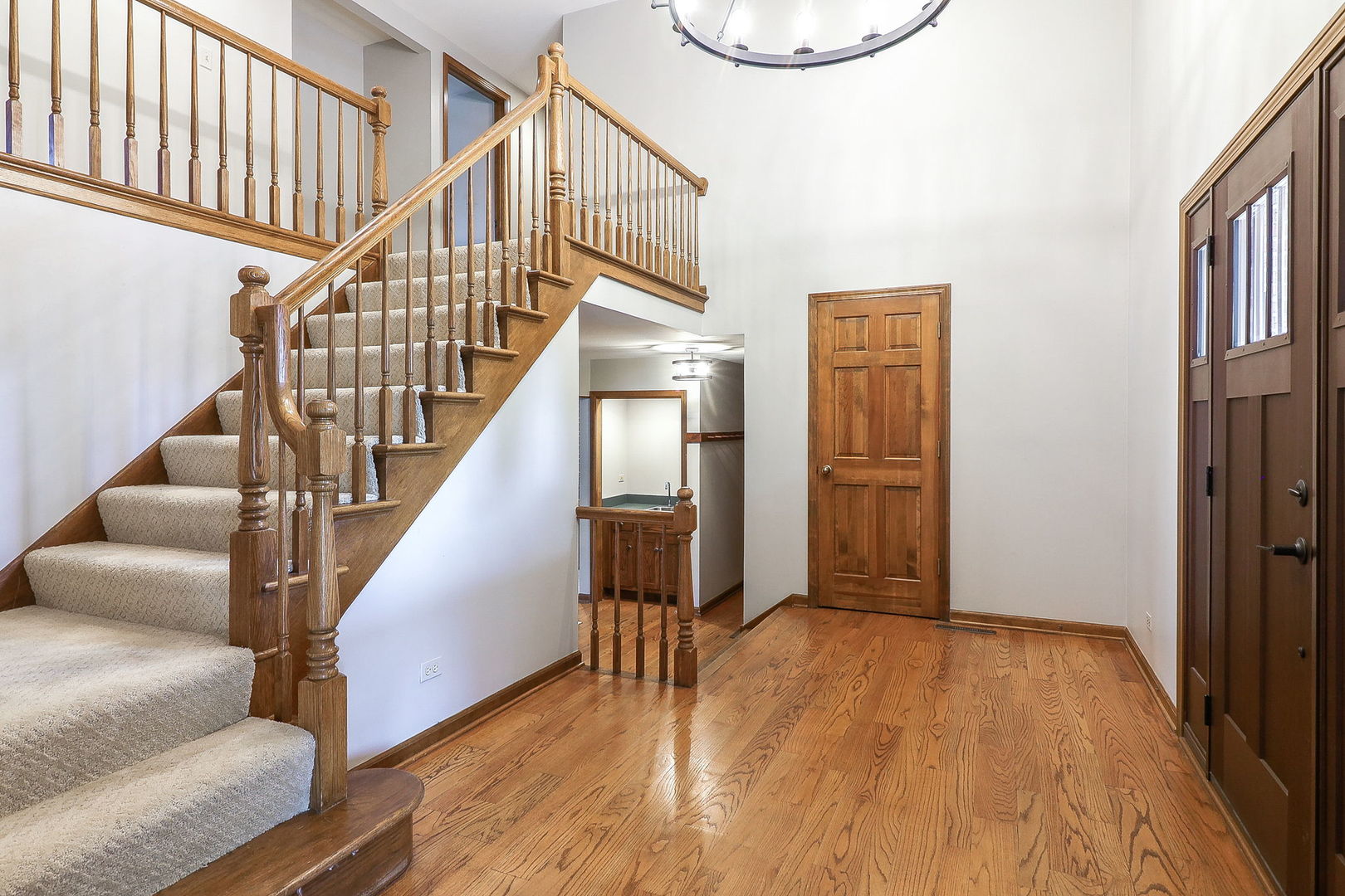 841 Turnbridge Circle Naperville, IL 60540 - Photo 3 of 39 a view of entryway and hall with wooden floor