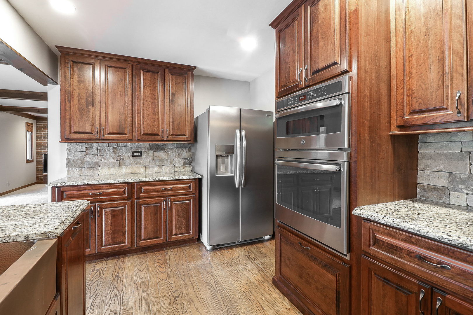 841 Turnbridge Circle Naperville, IL 60540 - Photo 10 of 39 a kitchen with granite countertop stainless steel appliances and wooden cabinets