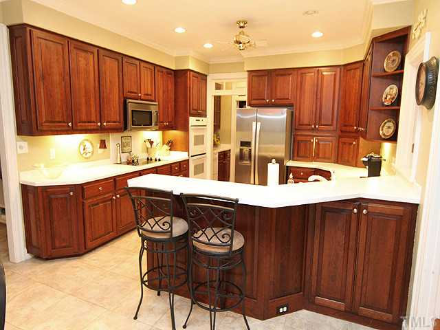 Beautiful custom cabinets and recessed lighting provide that special touch. Kitchen