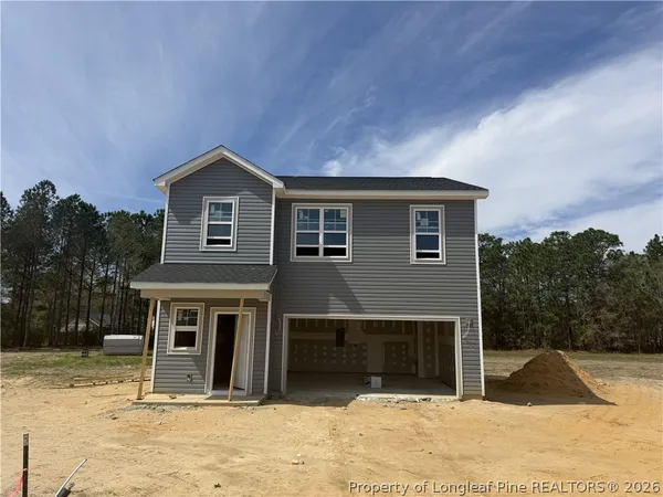 a front view of a house with a garage