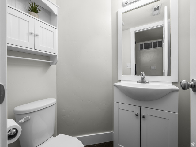 624 South 850 West Springville, UT 84663 - Photo 13 of 34 White vanity with integrated sink, framed mirror, and chrome faucet