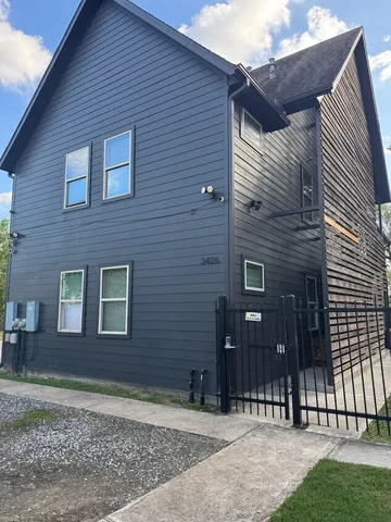 a brick house with a large windows
