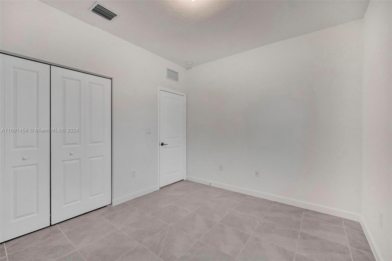 13405 Southwest 285th Street, Unit 13405 Homestead, FL 33033 - Photo 14 of 59 a view of an empty room
