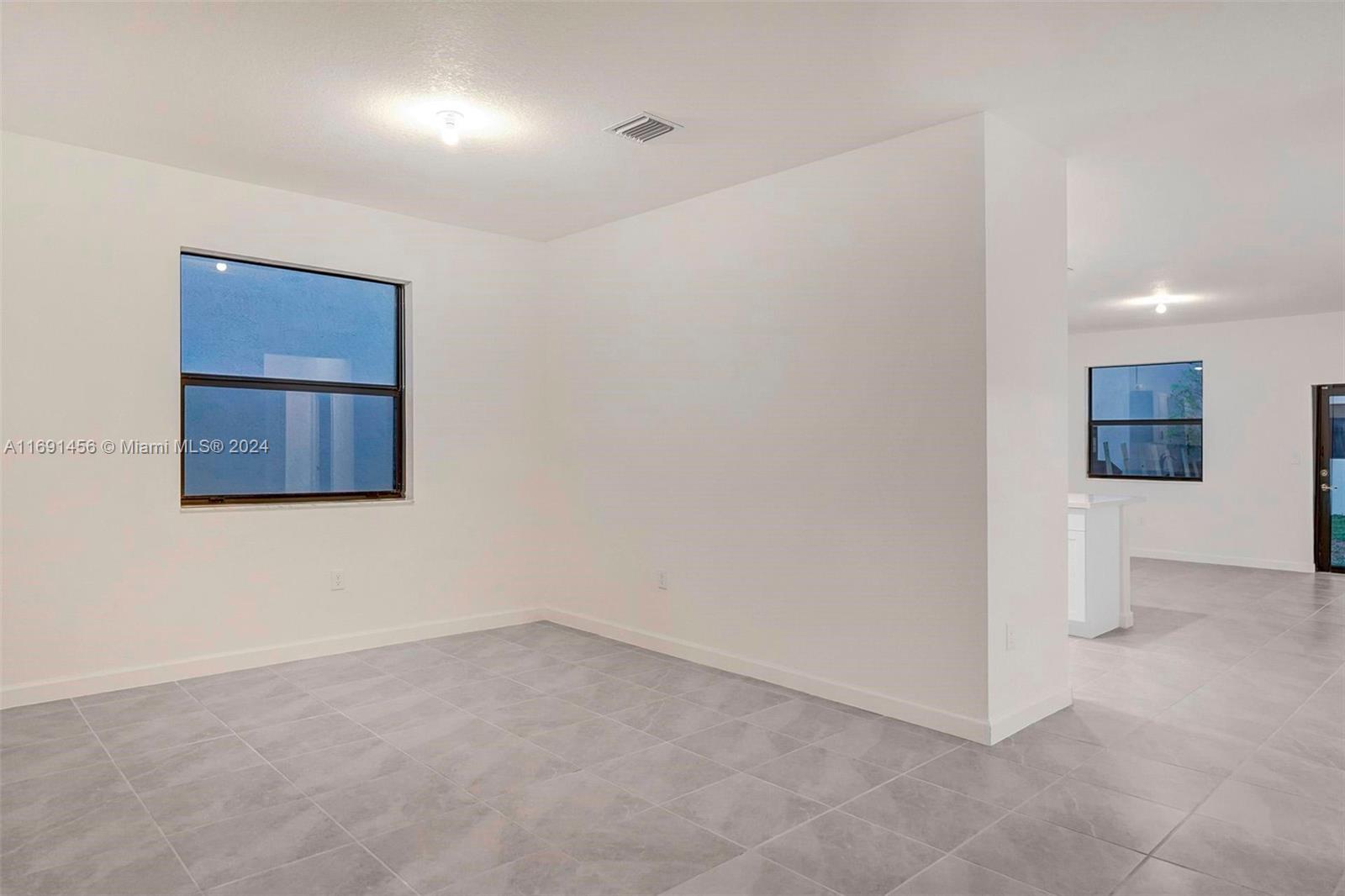 13405 Southwest 285th Street, Unit 13405 Homestead, FL 33033 - Photo 32 of 59 a view of an empty room