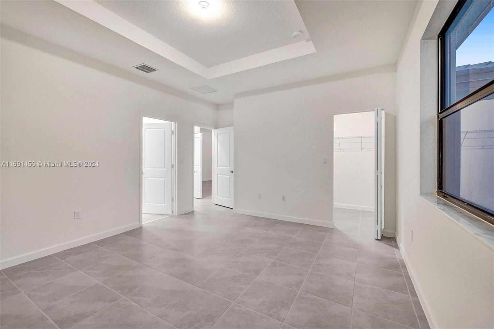 13405 Southwest 285th Street, Unit 13405 Homestead, FL 33033 - Photo 36 of 59 a view of an empty room