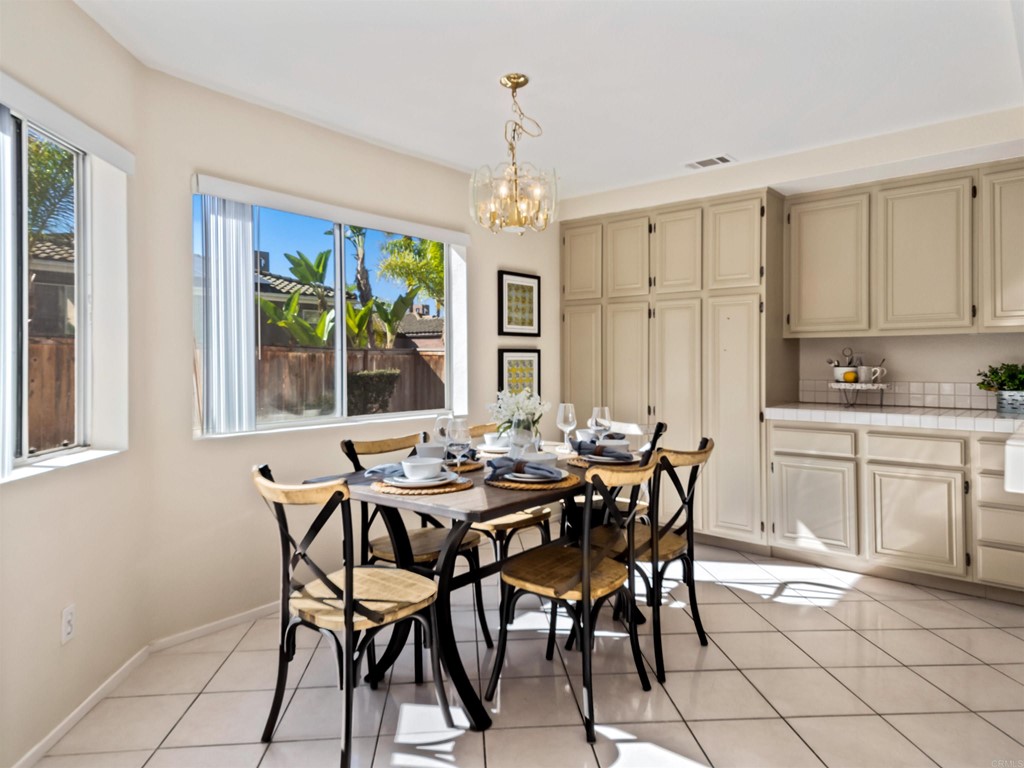 1593 Dawson Drive Vista, CA 92081 - Photo 13 of 40 a view of a dining room with furniture window and outside view