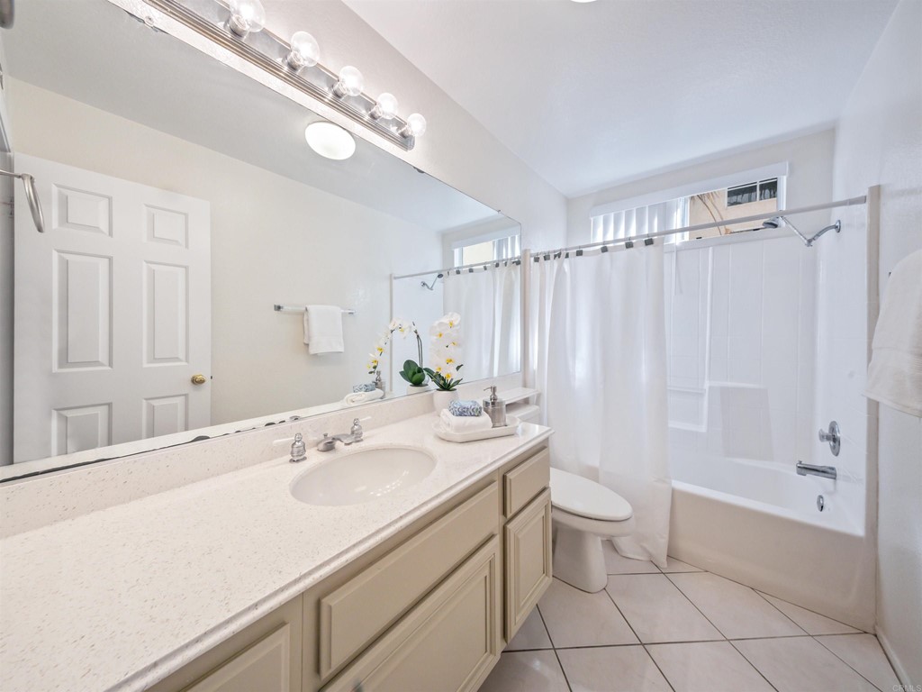 1593 Dawson Drive Vista, CA 92081 - Photo 19 of 40 a bathroom with a sink a toilet and shower
