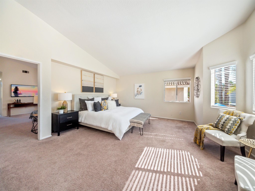 1593 Dawson Drive Vista, CA 92081 - Photo 23 of 40 a bedroom with furniture and a couch