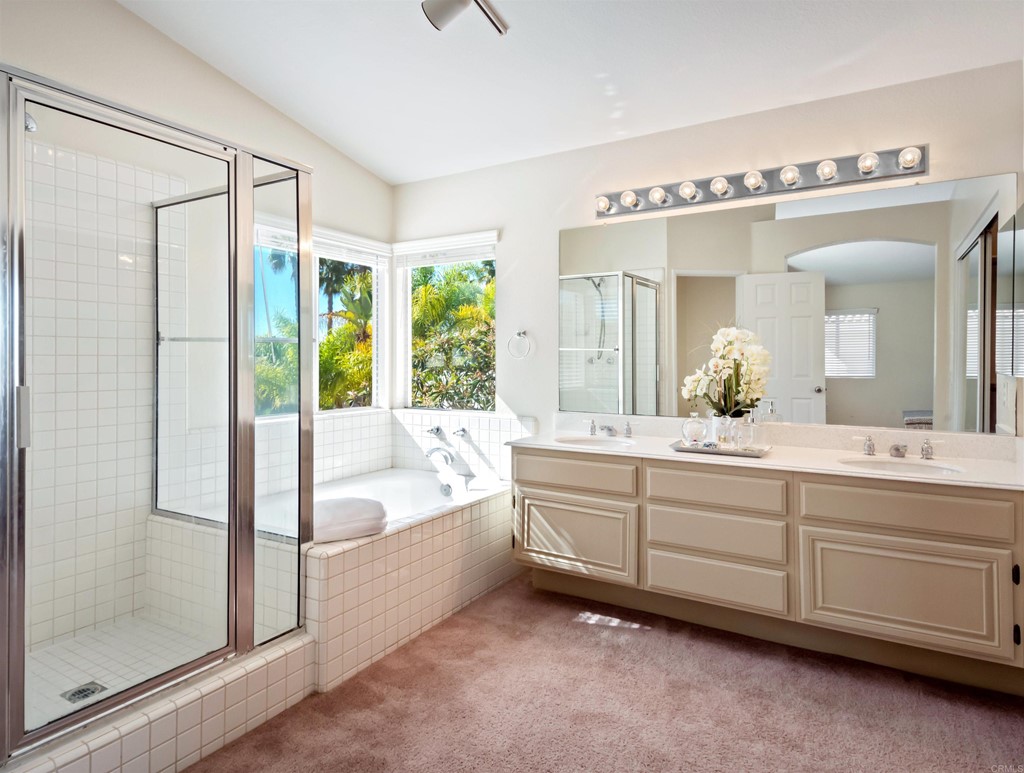 1593 Dawson Drive Vista, CA 92081 - Photo 27 of 40 a spacious bathroom with a tub sink and mirror