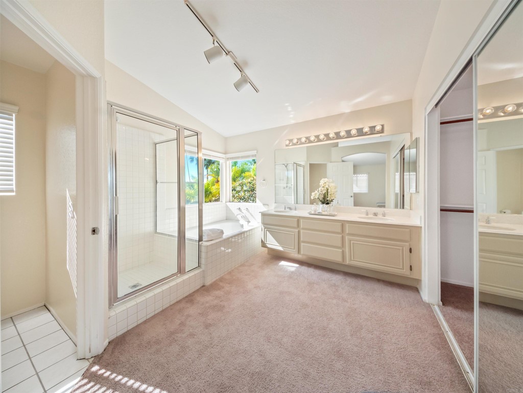1593 Dawson Drive Vista, CA 92081 - Photo 28 of 40 a bathroom with a double vanity sink mirror and shower