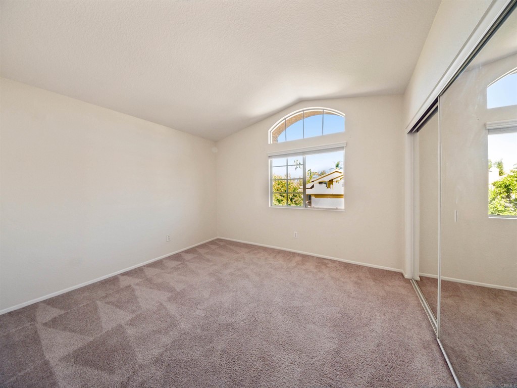 1593 Dawson Drive Vista, CA 92081 - Photo 32 of 40 an empty room with windows and mirror