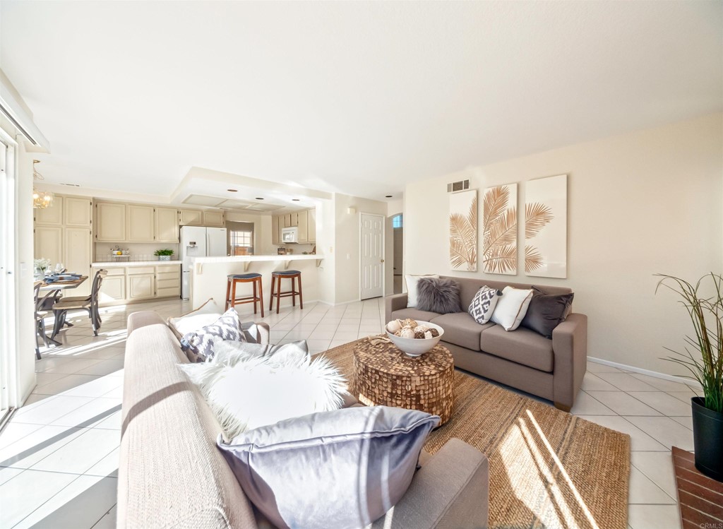 1593 Dawson Drive Vista, CA 92081 - Photo 10 of 40 a living room with furniture wooden floor and a large window