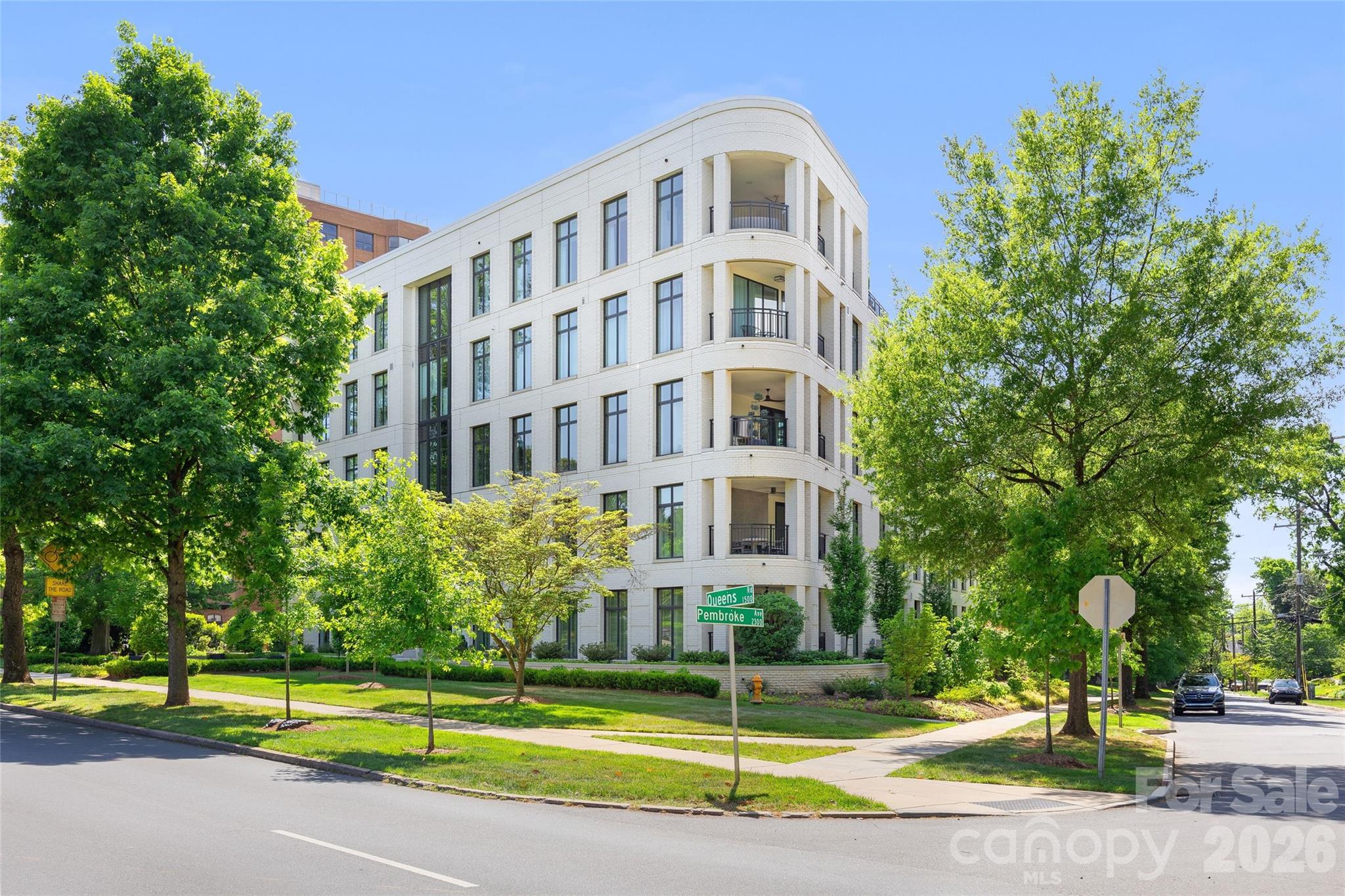 1500 Queens Road, Unit 104 Charlotte, NC 28207 - Photo 41 of 41 a view of a tall building next to a yard