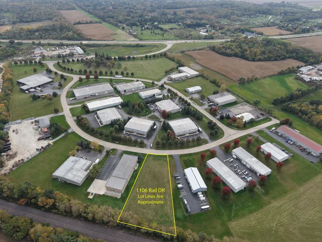 an aerial view of a house with outdoor space