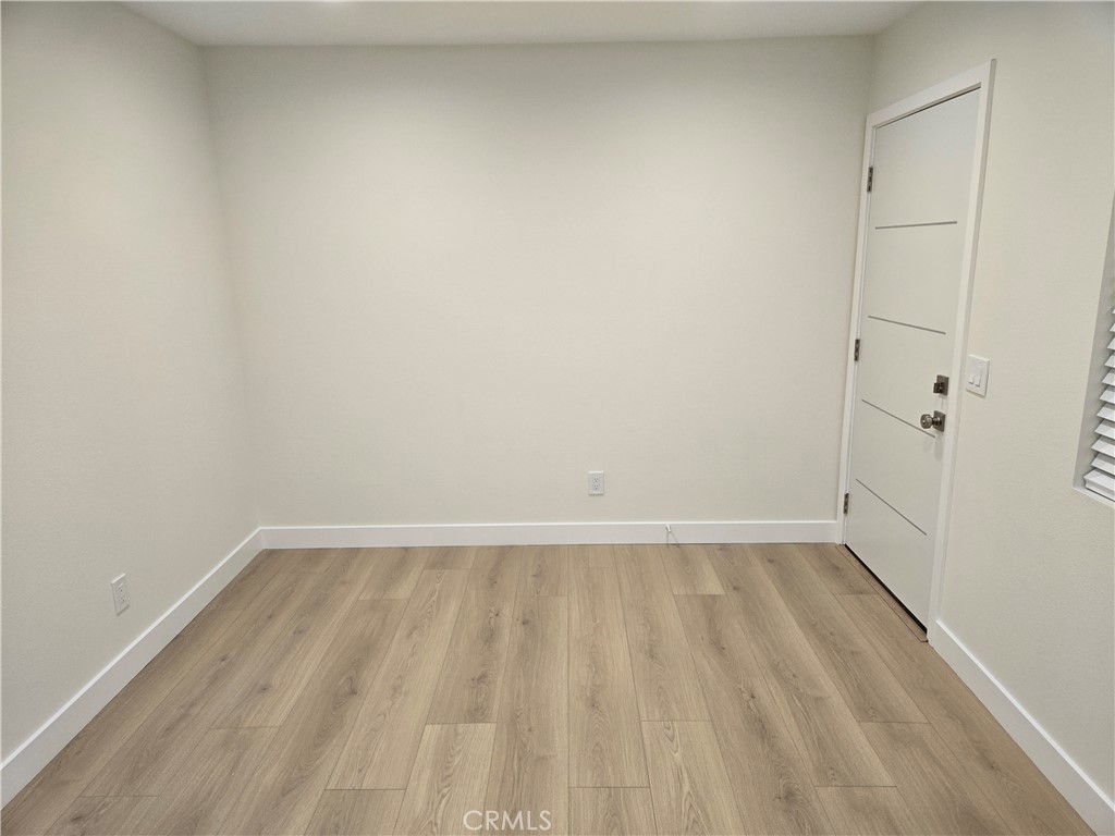8712 Oceanview Avenue, Unit B Orange, CA 92865 - Photo 3 of 9 a view of an empty room with wooden floor