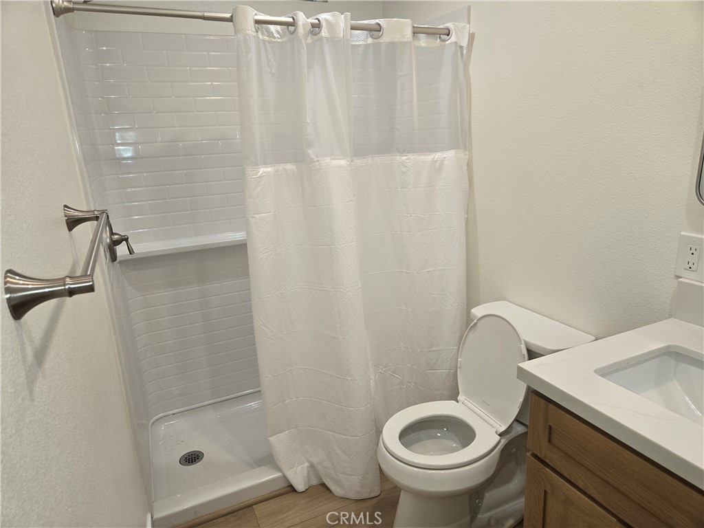 8712 Oceanview Avenue, Unit B Orange, CA 92865 - Photo 9 of 9 a bathroom with a toilet and a shower