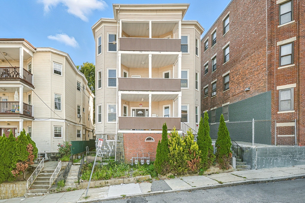 155 Wellington Hill Street, Unit 3 Boston, MA 02126 - Photo 20 of 20 a front view of a multi story residential apartment building