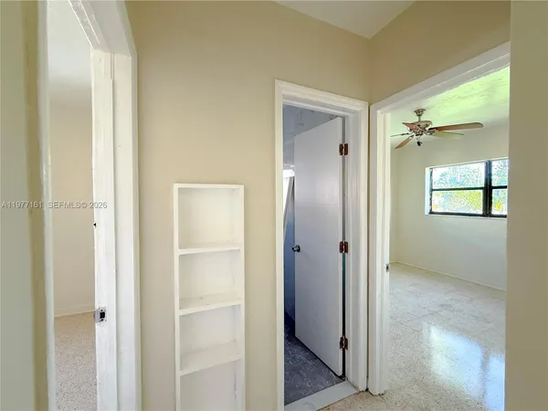 a view of a bathroom with a glass door shower