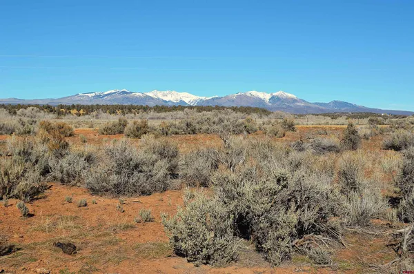 a view of a large body of water with a mountain in the background