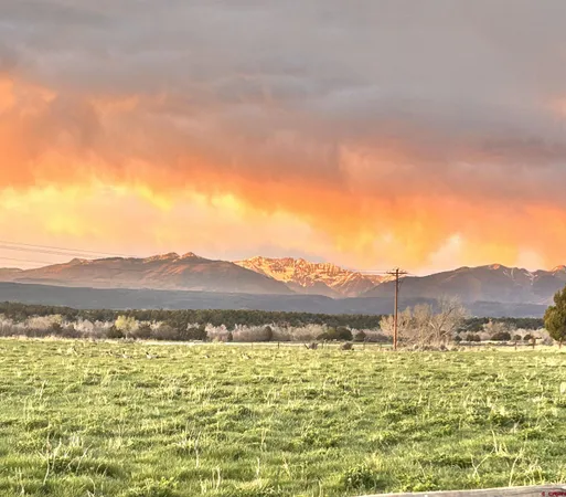 a view of an ocean and a mountain