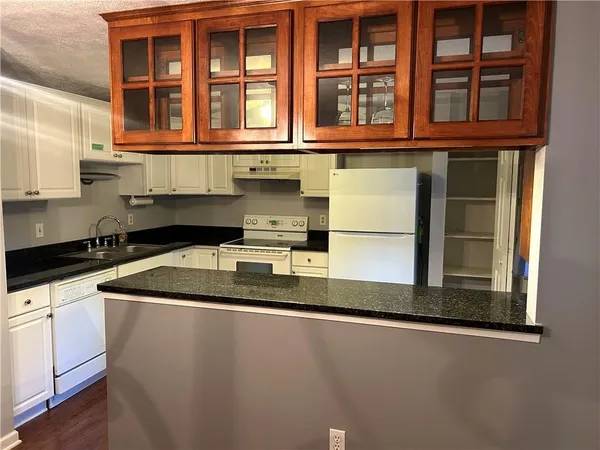 a kitchen with a sink and a window