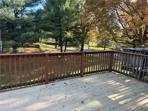 a view of a balcony with a bench