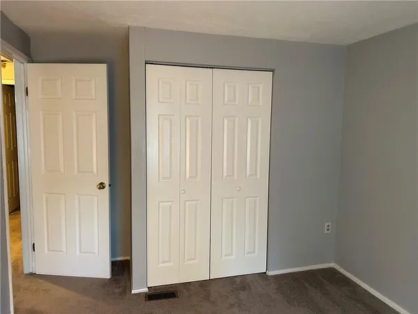 a view of a bathroom with a sink and a mirror