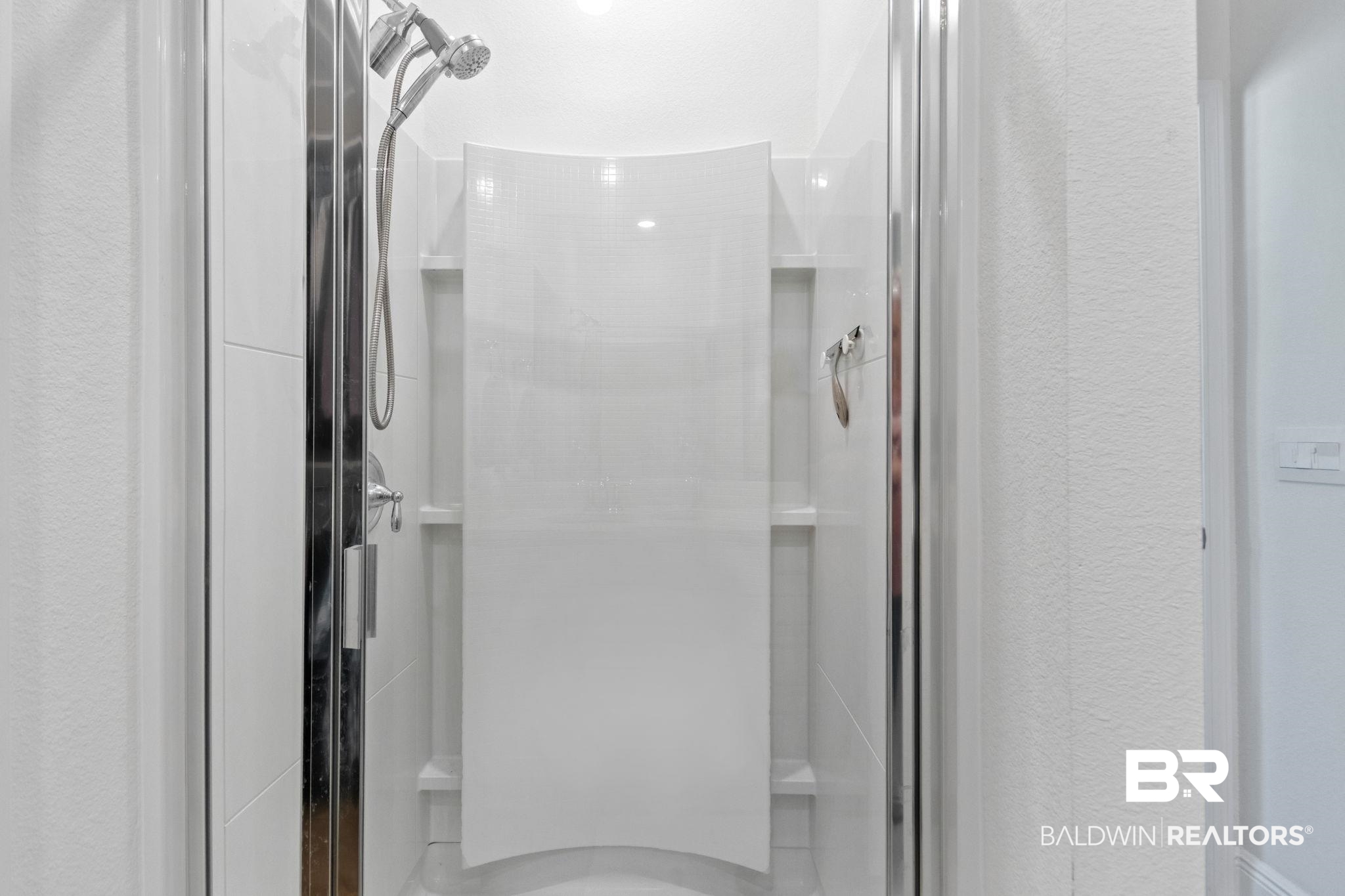 12919 Torrent Road Fairhope, AL 36532 - Photo 35 of 74 Full bathroom featuring a shower stall and a textured wall