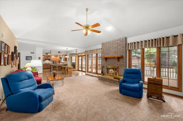 a living room with furniture fireplace and a flat screen tv
