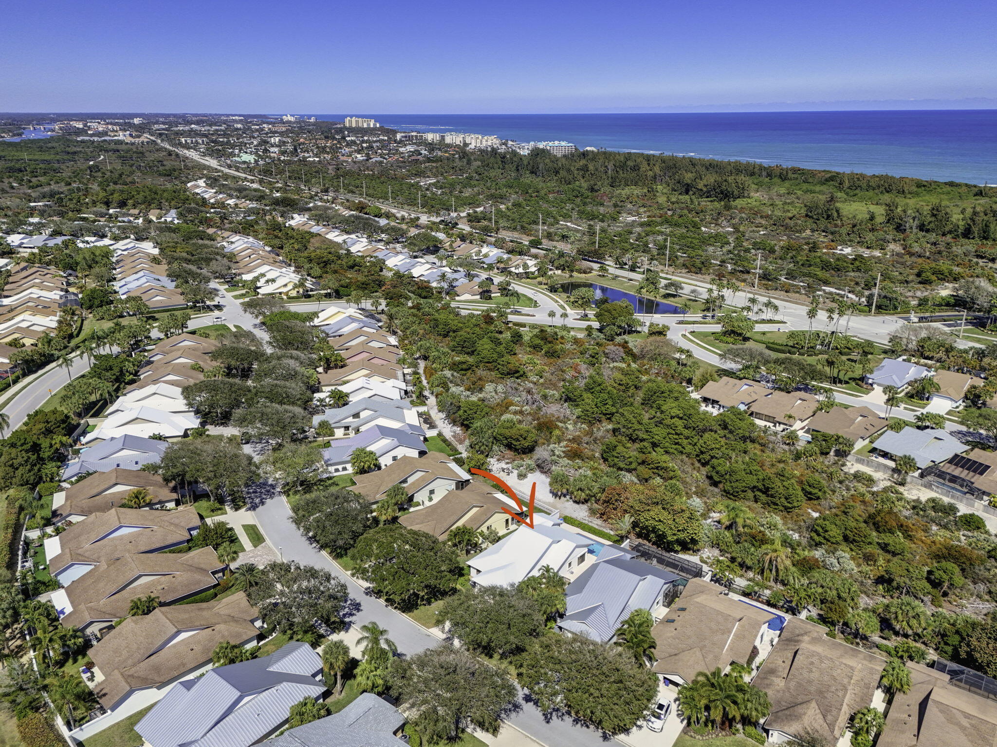 239 Ridge Road Jupiter, FL 33477 - Photo 64 of 75 an aerial view of residential houses with outdoor space and trees