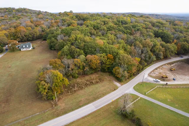 a view of a small pool with a yard