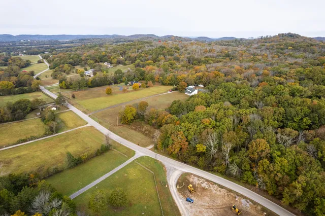 a view of a balcony with an outdoor seating and mountain view