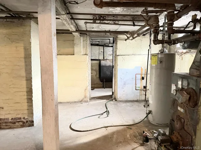 a bathroom with a granite countertop shower and a mirror