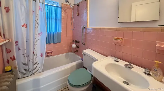 a bathroom with a sink and toilet