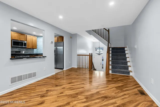 a dining room with a table and chairs