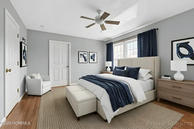 an empty room with a chandelier fan and windows
