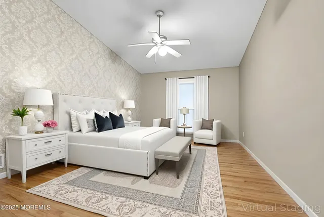 an empty room with a chandelier fan and closet area
